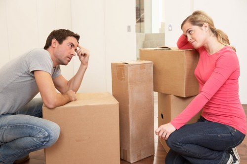 Staff preparing desks and equipment for office removals in Sydenhamhill